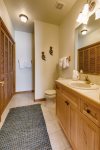 Full bathroom with stand up shower and washer/dryer